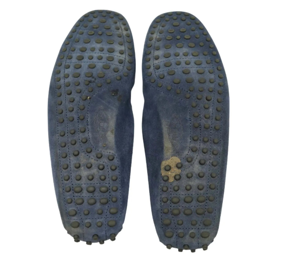 Tod’s blue suede Gommino loafers styled for travel and relaxed luxury outfits