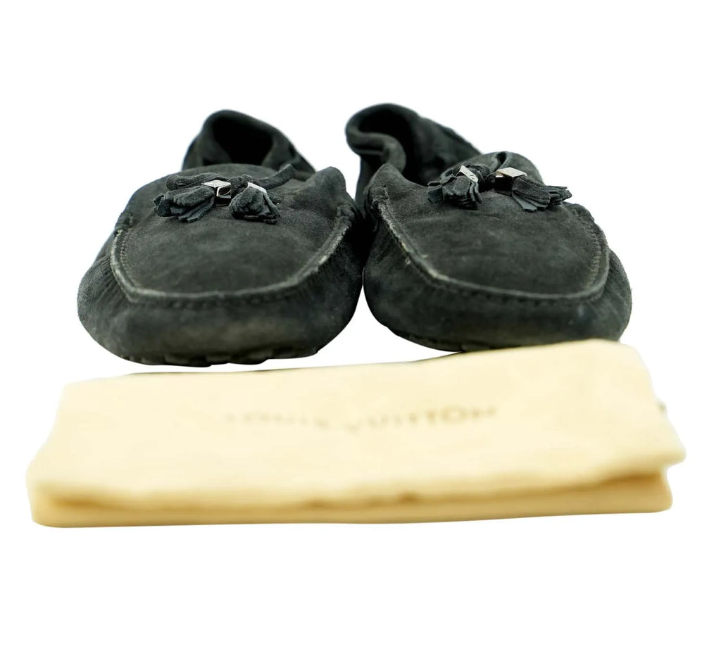 Louis Vuitton black suede tassel loafers styled for formal events and smart casual outfits