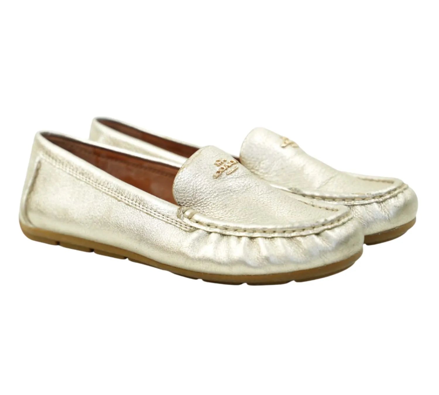 trending Coach champagne metallic driver loafers with slip-on design, stylish casual footwear