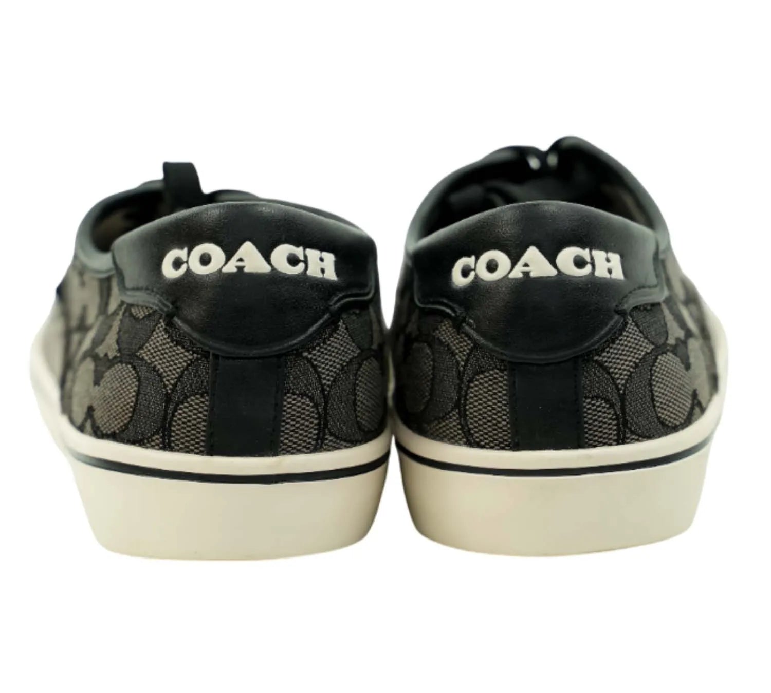 editorial style Coach charcoal black sneakers styled with casual streetwear outfit