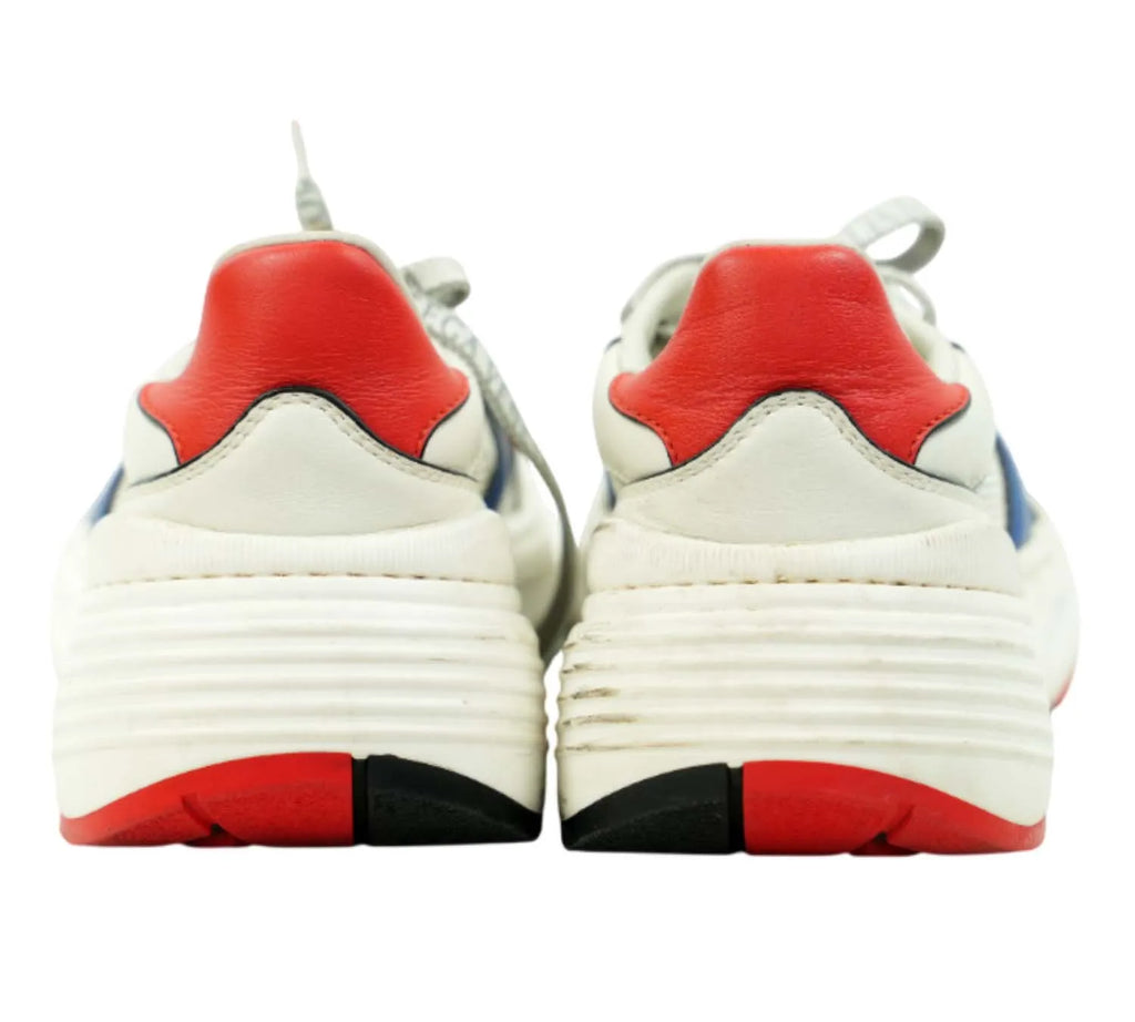 editorial shot of Bottega Veneta colour-block Speedster sneakers styled with streetwear outfit