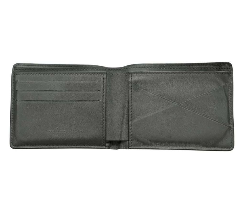 editorial style Louis Vuitton Aerogram wallet styled with modern accessories